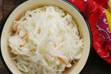 Sauerkraut with carrots on the table macro 