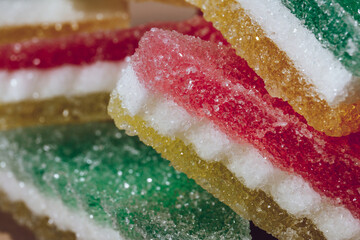 Multi-colored marmalade jelly candy's. Heap of colorful marmalade candy close-up. Macro shot, selective focus.
