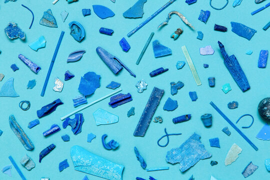 Pieces of blue plastic on the blue background