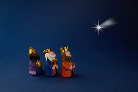 Happy Epiiphany day. Three wise man ant star on blue background.