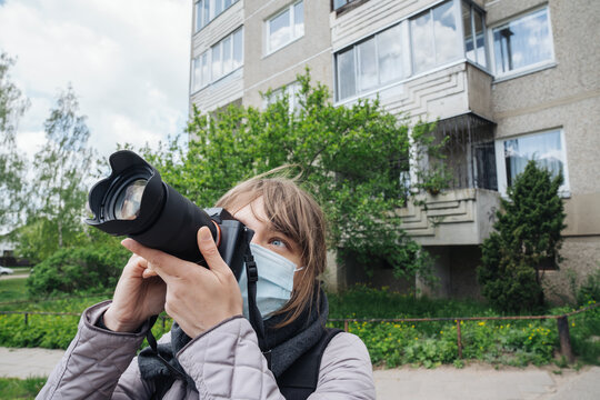 Woman Wearing Face Mask Taking A Photo Outdoors