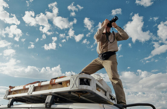 Film color. Nature photographer photographed on the roof of the