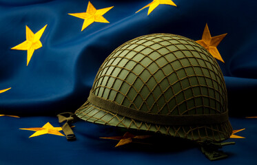 European union army, military uniform and defense of Europe concept with soldier helmet with...