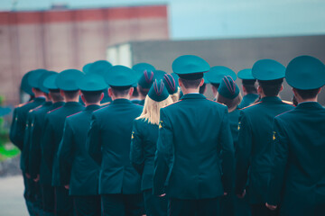 A formation line of russian army soldiers troops in military formation in uniform with chevron "Russian Armed Forces", line up during the taking the oath of allegiance ceremony
