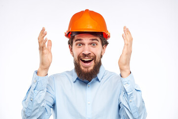 Cheerful male orange hard hat safety professional construction engineer
