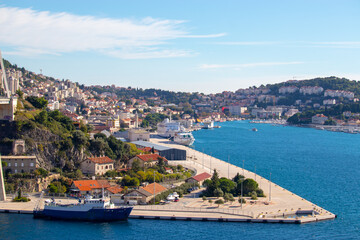 Fototapeta na wymiar Dubrovnik Croatia October 2020 Panorama of the bay area of Dubrovnik city, entrence to the town in front of the massive bridge. Sunny warm day with bright blue sea