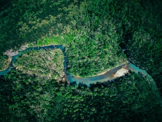 Aerial shot of a winding river in the green Arkansas wilderness © Sherrod Photography