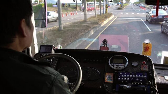 4K, Close-up of old male hands driver steering wheel in a bus, driving passenger. Transport in a communal road vehicle and carrying people, typically serving the public on a route and for a fare.-Dan