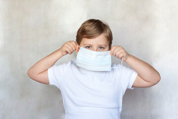 A boy in a medical mask. Coronavirus, disease, infection, quarantine, medical mask, COVID-19....