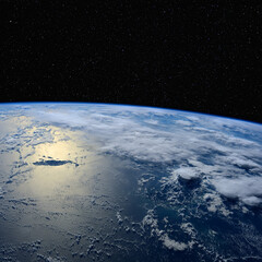 Sunlight reflects off the ocean. Elements of this image furnished by NASA.