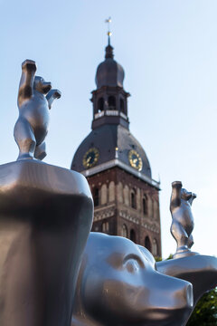 'Respect for life' bear at United Buddy Bears international art exhibition (Artists: A. Oetker, A. Haufe) with Riga Cathedral tower in background.