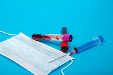 New coronavirus blood test(2019-nCoV), medical face mask, syringe and needle, test tube coronavirus blood test