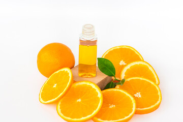 Orange oil for the body. Sliced orange on a white background. Organic SPA cosmetics with herbal ingredients.