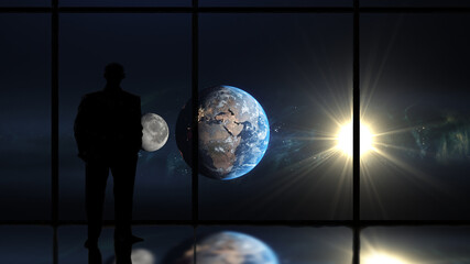 Man looking at earth and moon through a window