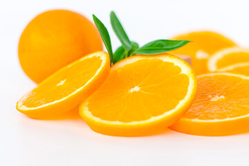 Cut orange on a white background. Natural orange fruit with cut slices. Vitamin C.