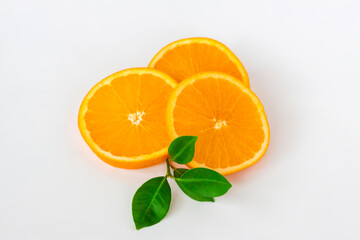 Cut orange on a white background. Natural orange fruit with cut slices. Vitamin C.