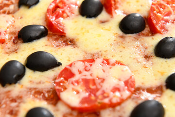 homemade pizza, vegetarian food, baked vegetables and cheese, tomatoes and olives, delicious food on a wooden background