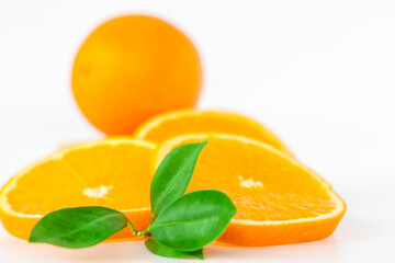 Cut orange on a white background. Natural orange fruit with cut slices. Vitamin C.