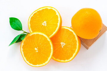Cut orange on a white background. Natural orange fruit with cut slices. Vitamin C.