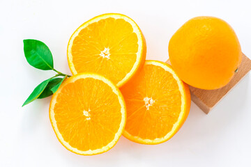 Cut orange on a white background. Natural orange fruit with cut slices. Vitamin C.