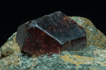 Semiprecious stone corundum ruby in the rock.