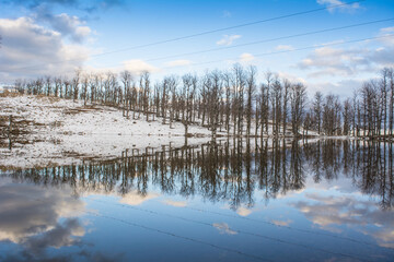 Algeria, a reflection in a snow lake surrounded by trees, this beautiful lake is located in the mountains of the state of Jijel, Algeria, North Africa