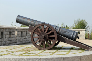 an ancient cannon on the top of a fortress
