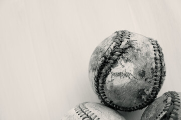 Old baseball texture of ball in black and white with copy space.
