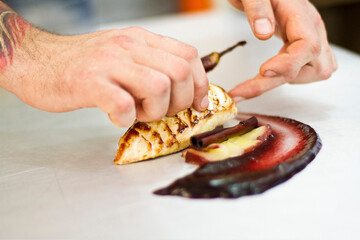 hand holding a piece of meat