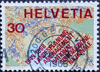 Switzerland - Circa 1968 : a postage stamp printed in the swiss showing aa map section with the text: country planning