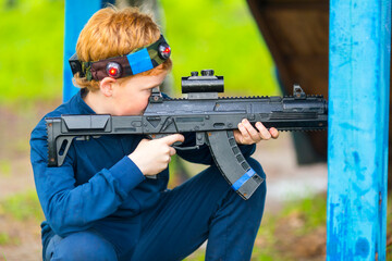 Boy with a gun playing laser tag