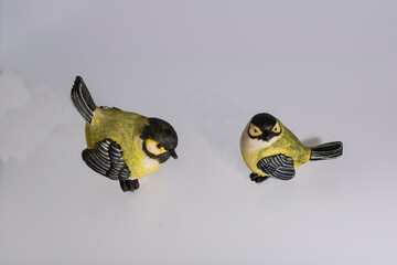 Figurines of two titmice made of clay