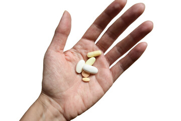 Isolated hand holding pile of different pills, on white background 
