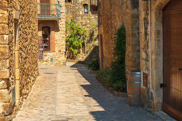 Fototapeta na wymiar Cozy narrow little streets in a Catalan fishing village on the Costa Brava, Mediterranean Sea