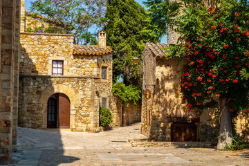 Fototapeta na wymiar Cozy narrow little streets in a Catalan fishing village on the Costa Brava, Mediterranean Sea