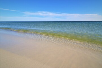 Sand, ocean, sky, tranquility and relaxation, photo taken on the beach of Santa Rose Island, Gulf of Mexico