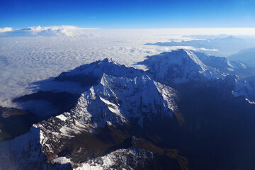 Flying over the snowy mountains in Cusco, Peru