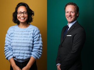 Two beautiful people in front of a background