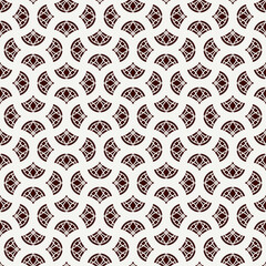 Ethnic, tribal wallpaper. Repeated segmented circles seamless pattern. Openwork ornament. Delicate ornamental background