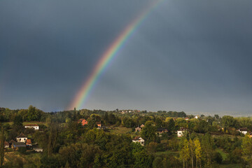 Rainbow above the rural Serbian landscape