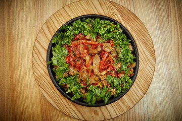 vegetables and meat in a pan