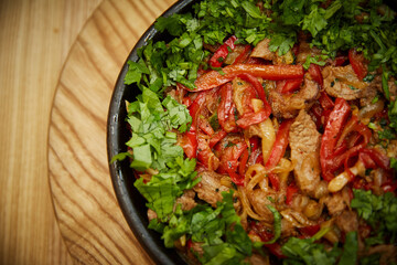 vegetables and meat in a pan