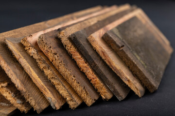 Raw boards piled up. Wood on the table in the workshop.