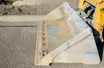 close up of a heavy duty bucket on an earth mover with copy space