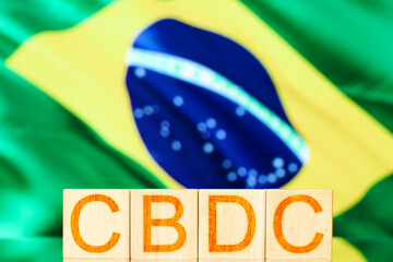 cbdc brazil. wooden cubes with the inscription cbdc on the background of the national flag of brazil