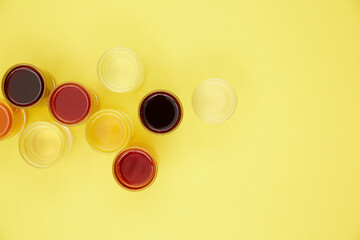 colored drinks on a yellow background