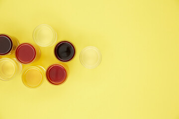 colored drinks on a yellow background