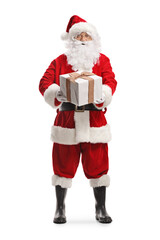 Full length portrait of Santa claus holding a big present box