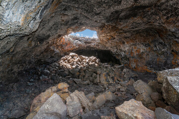 A lava tube (cave) at the Craters of the Moon National Monument and Preserve located in Idaho, USA.