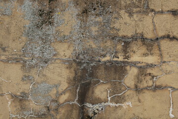 Gelb grau verputzte Betonmauer